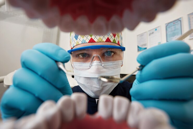 dentist examining mouth patient 273609 13097