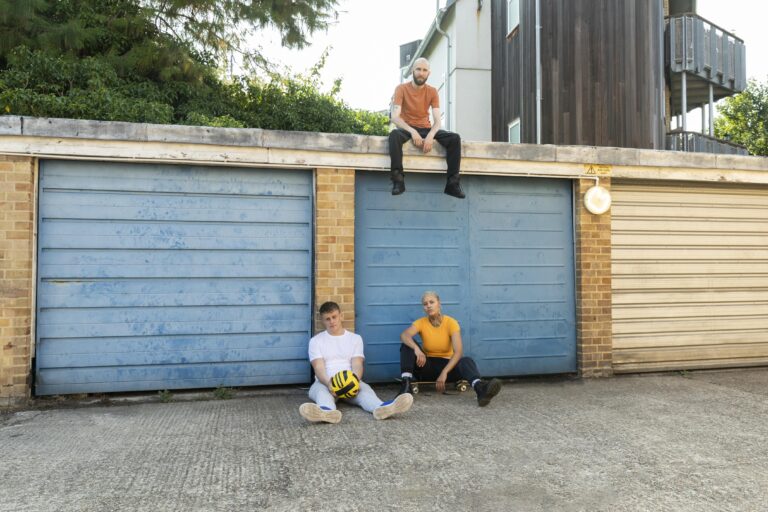 long shot friends sitting outdoors