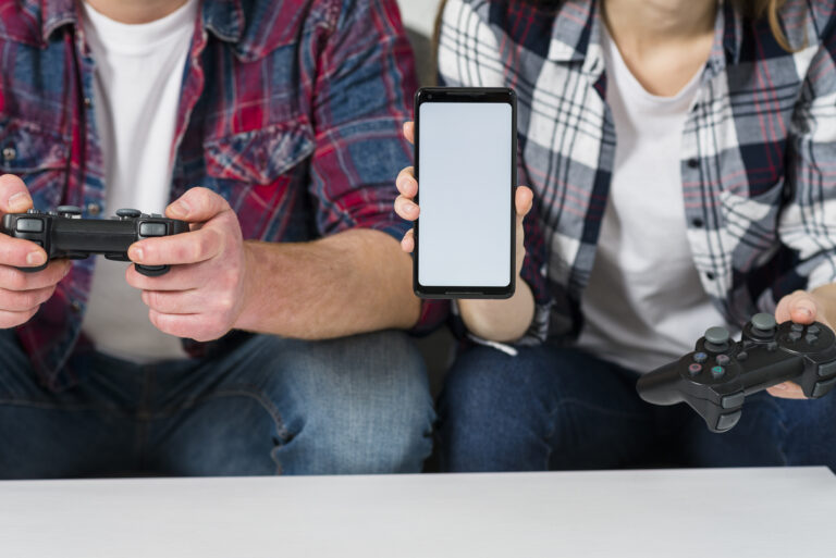 How Mobile Gaming Changed the Industry Forever 1 pensive colleagues using modern device while taking statistics
