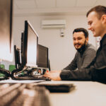 young male web designers working computer